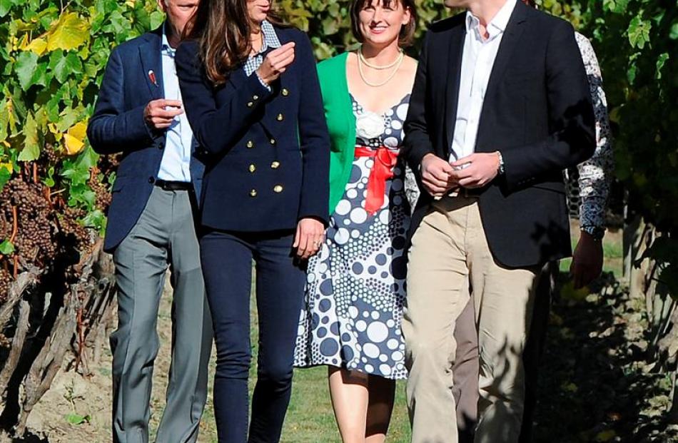 The Duchess of Cambridge tries pinot gris grapes as she and the Duke of Cambridge visit Amisfield...
