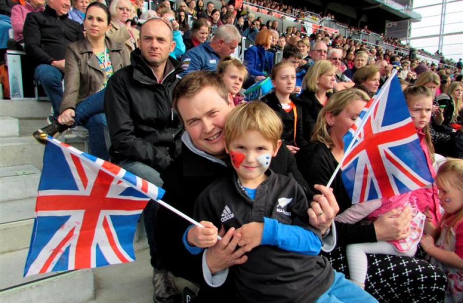 Brendon Jarvie and son William (5) watch from the stands. Photo by Vaughan Elder.