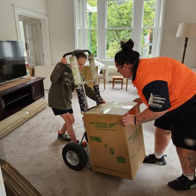 Mover in the making! Incredible Caitlin turning packing into a playful adventure.