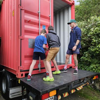 Haydn and Christian closing the container: Thanks to the crew for letting the boys seal our...