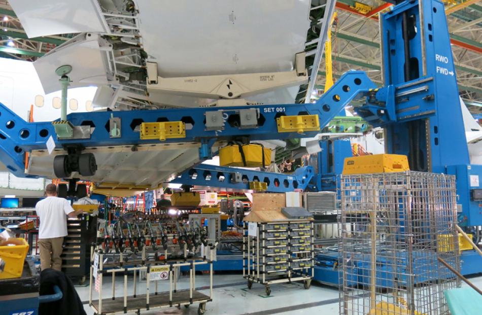 A Dreamliner wing being attached.