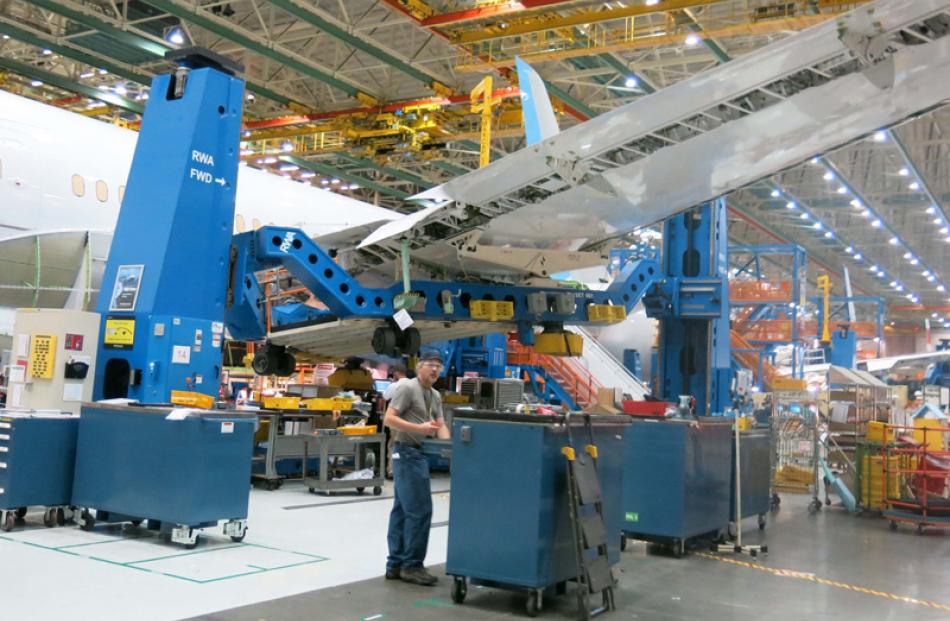 A Dreamliner wing being attached.