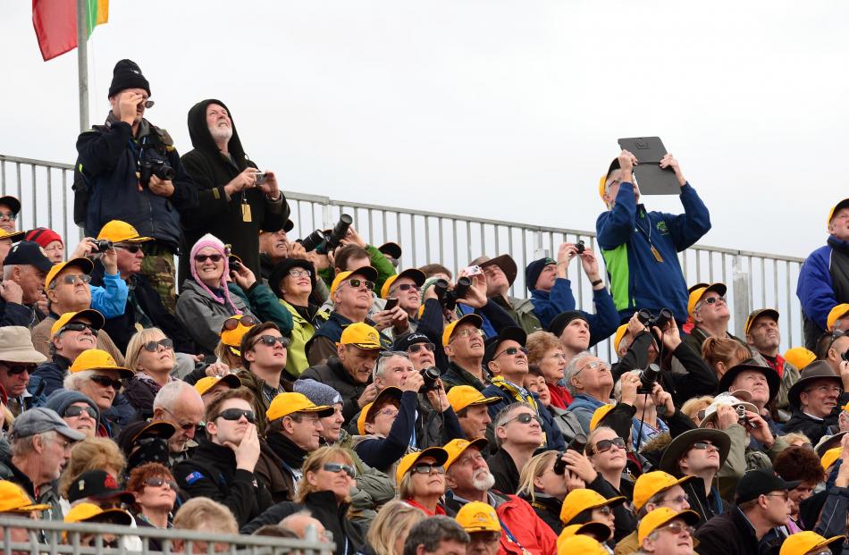 Members of the gold members stand watch the action.