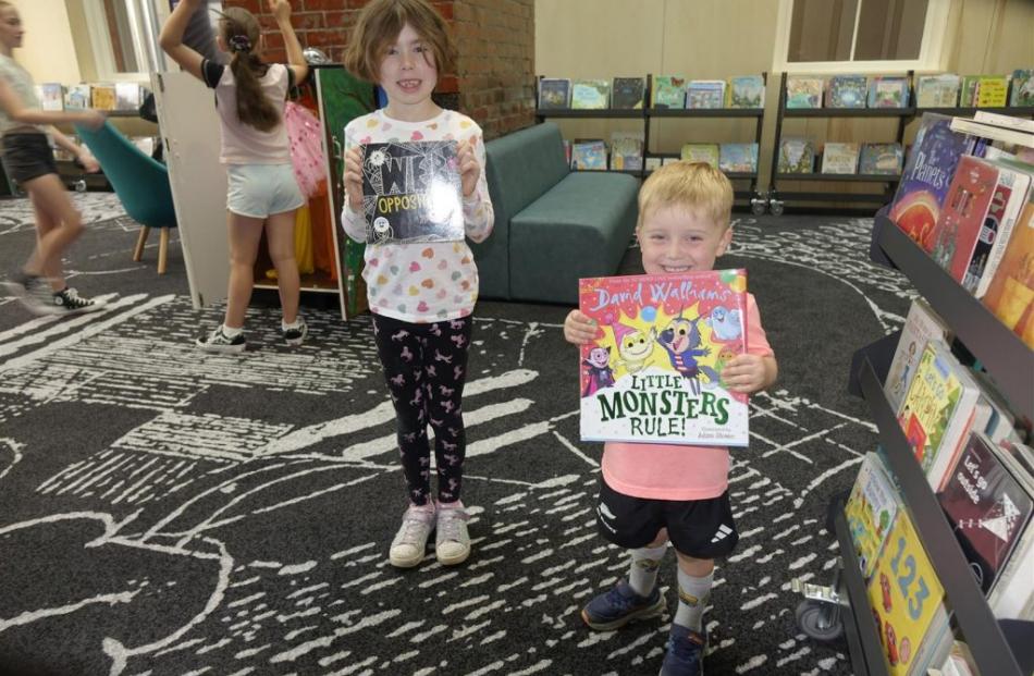 Cousins Dixie Smith, 7, and Thomas Copland, 3, of Ashburton, make their selections in the...