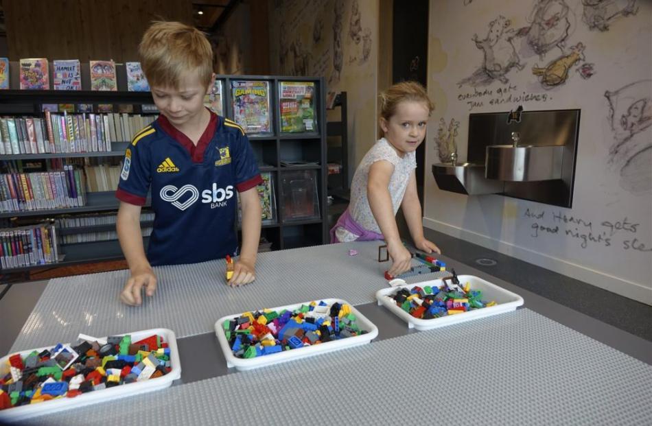 Eight-year-old Lochlann Veint and his sister Lucy, 5, have fun at the Lego table.