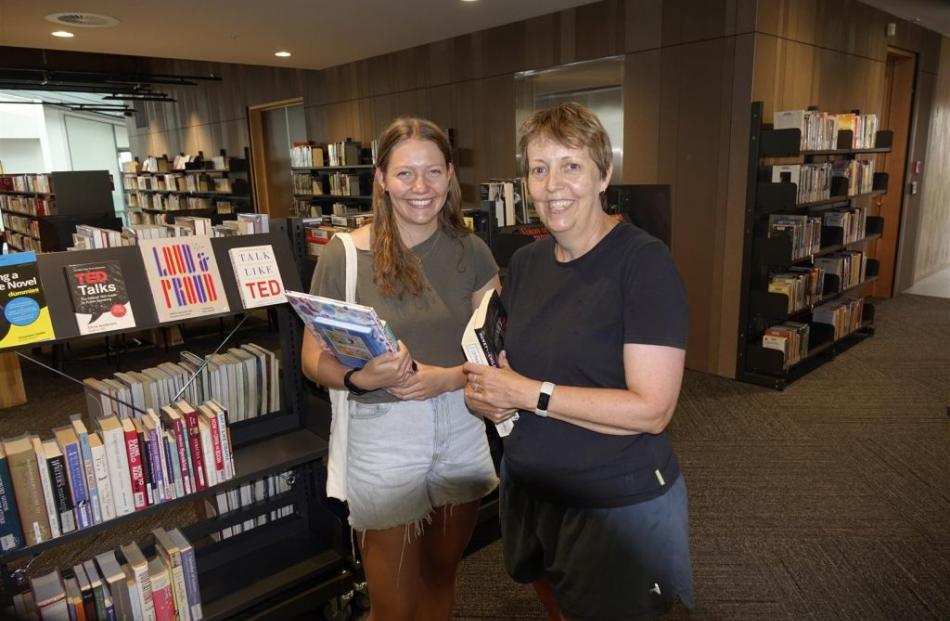 Hannah Wakelin and her mum Joanne were among book borrowers on the library’s opening day.