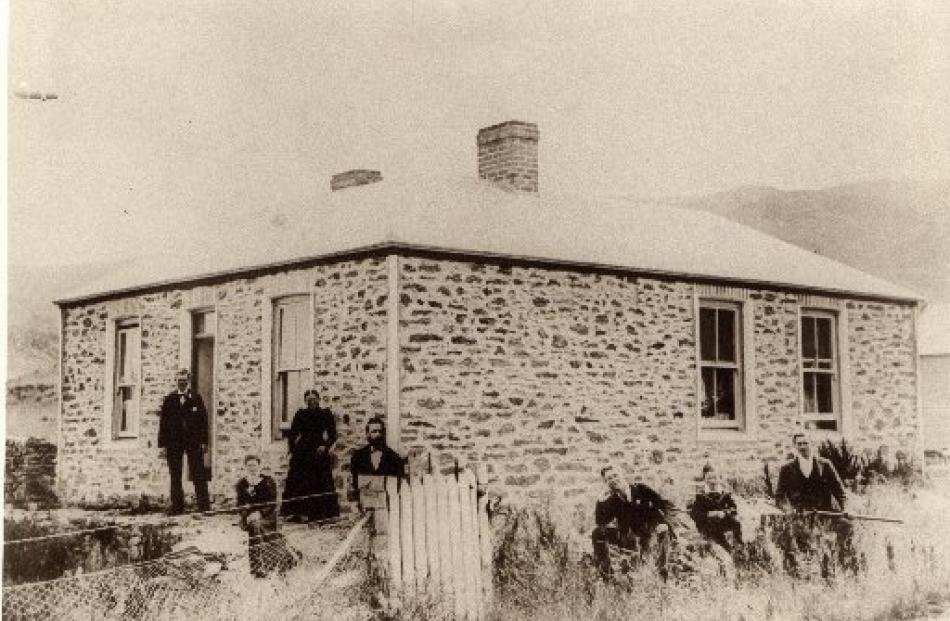 Gunn family members gather at the original Gunn homestead at Coal Creek on April 12, 1899, the...