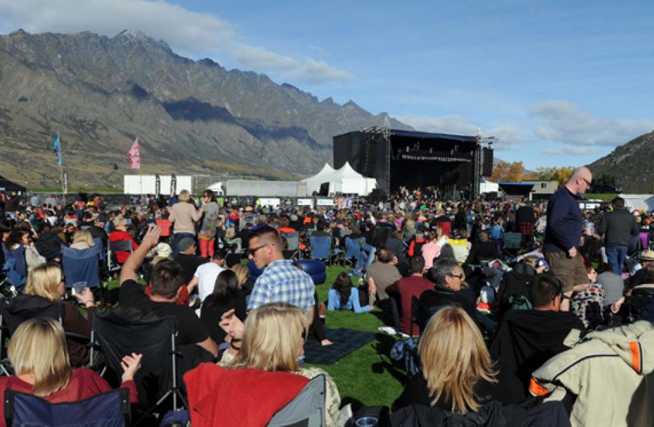 The crowd watches the performance.