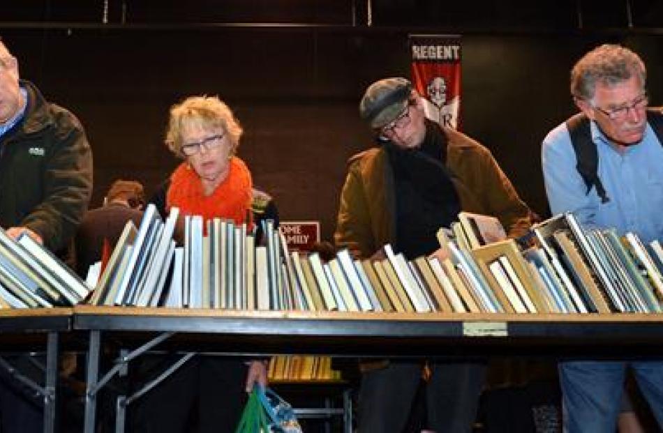 Potential buyers  peruse  books at the 34th Star Regent 24 Hour Book Sale yesterday.