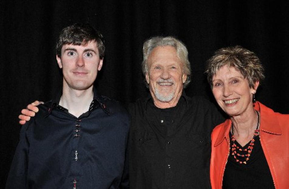 Kristofferson with Dalaine Walker and her son, Kris Collins, on stage earlier in the night. ...