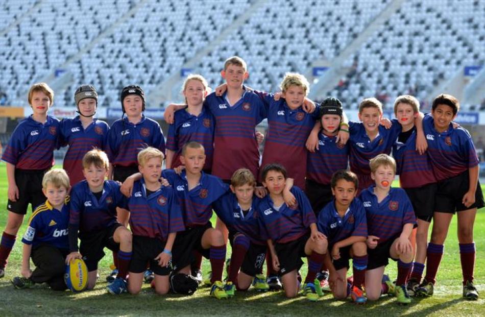 West Taieri under-11 players pose for a  photo before their match at the stadium.