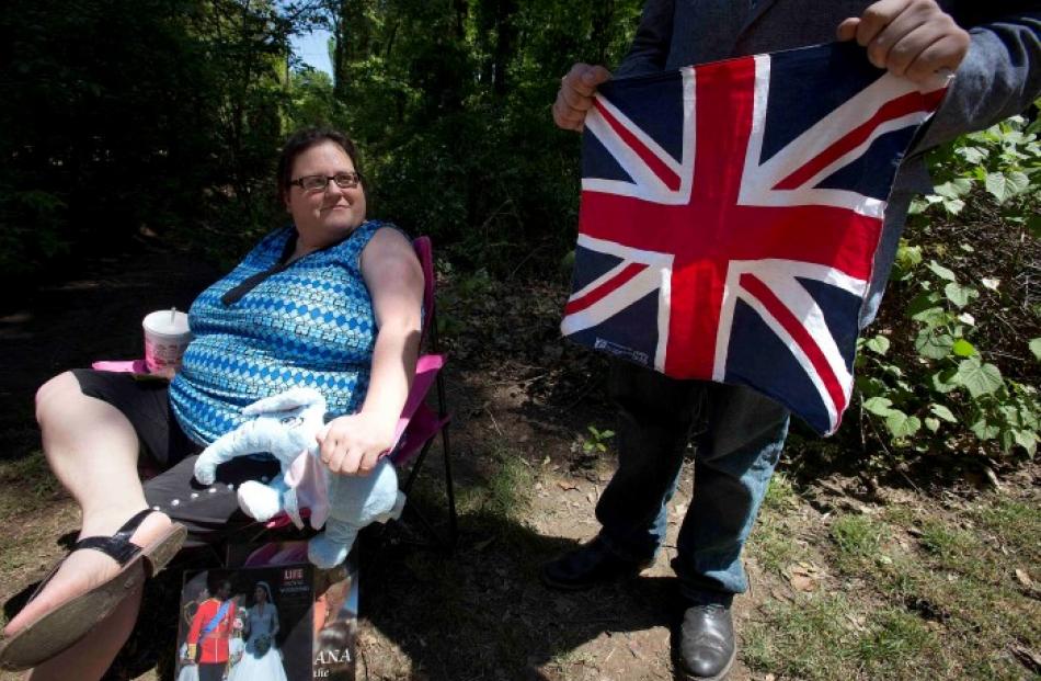 Amy Harp looks on as son Danny Harp holds a Union Jack at the entrance to the Memphis Hunt and...