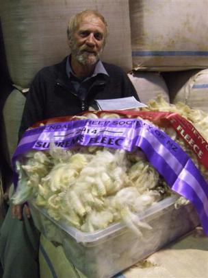 Oxford Perendale breeder Ivan Evans with his fleece that was named supreme champion in the...