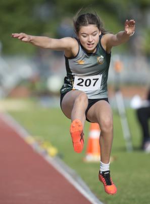 Tessa Krause makes her leap in the girls under-15 long jump.
