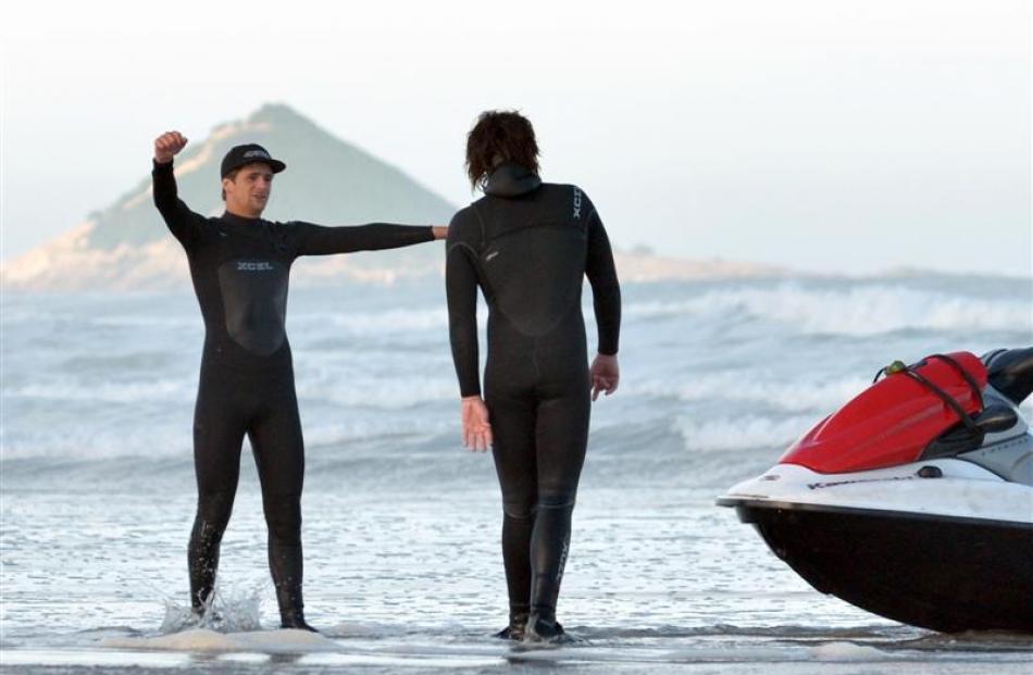 Dan Smith (right) chats to a fellow surfer, who declined to be named, after their jet ski was...