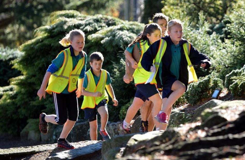 East Taieri School pupils (from left) Kate Hanna (11), Ollie Ritchie (10), parent Jim Cotter,...