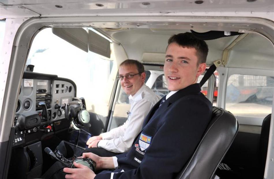 In a Cessna 172 at Taieri Aerodrome, in Mosgiel, are (from left) Otago Aero Club pilot Andrew...