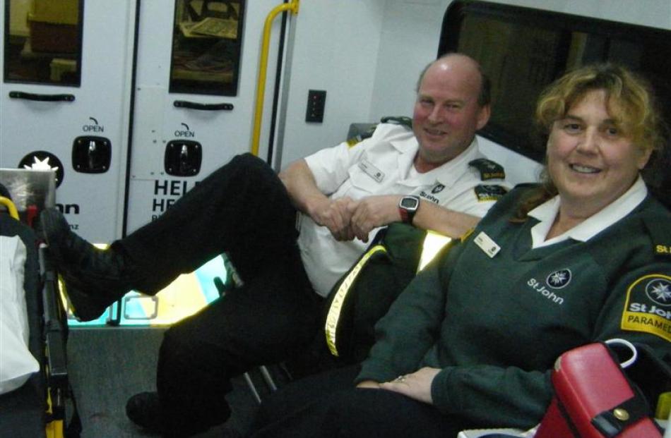 Ambulance officers Pat Bain and Debby Foster sit in the ambulance.