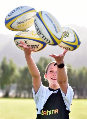 Olivia Scott, 11, of Tahuna Normal Intermediate School, throws rugby balls.