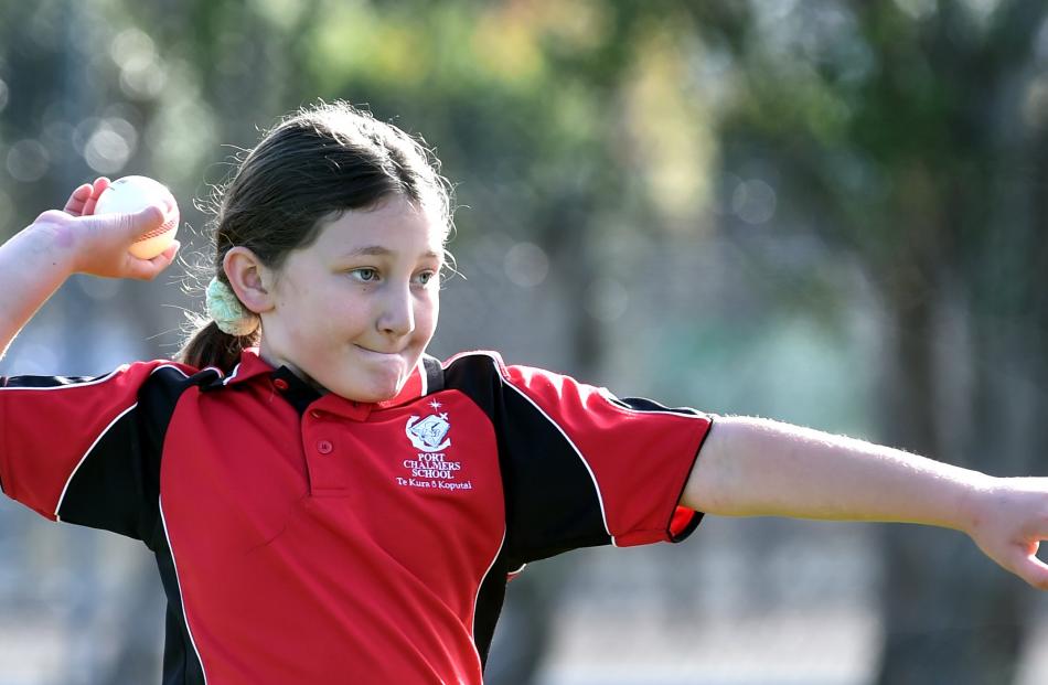 Manaia Matapo, 8, of Port Chalmers School, gets ready to throw a cricket ball.