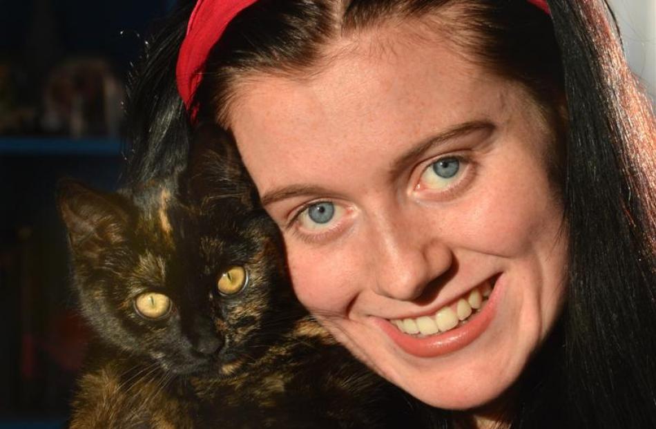 Nikita Rosenbrock (17), of Concord, with Cat.