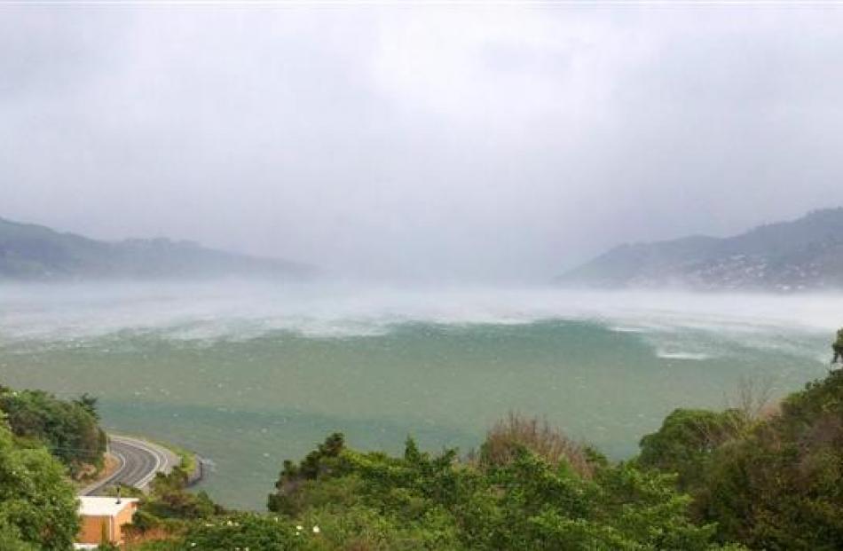 A southerly front charges up Otago Harbour towards Macandrew Bay at 3.09pm on Saturday. Photo by...