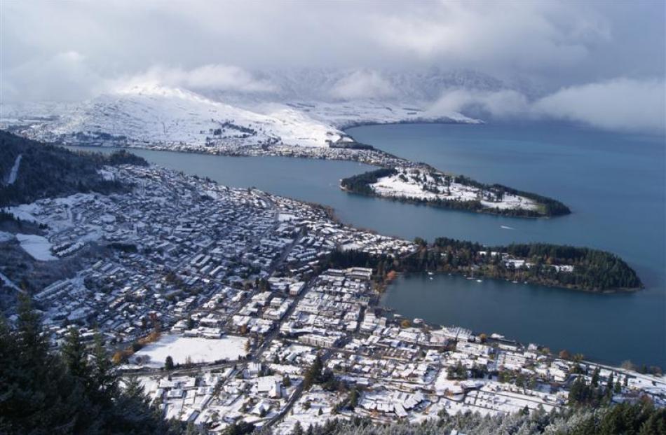 A snow-covered Queenstown from the Skyline.