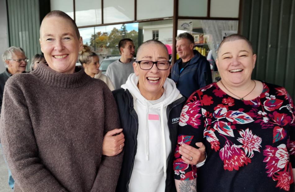All smiles after their head shaves are (from left) Andrea Buxton, Jane Roberts and Michelle...