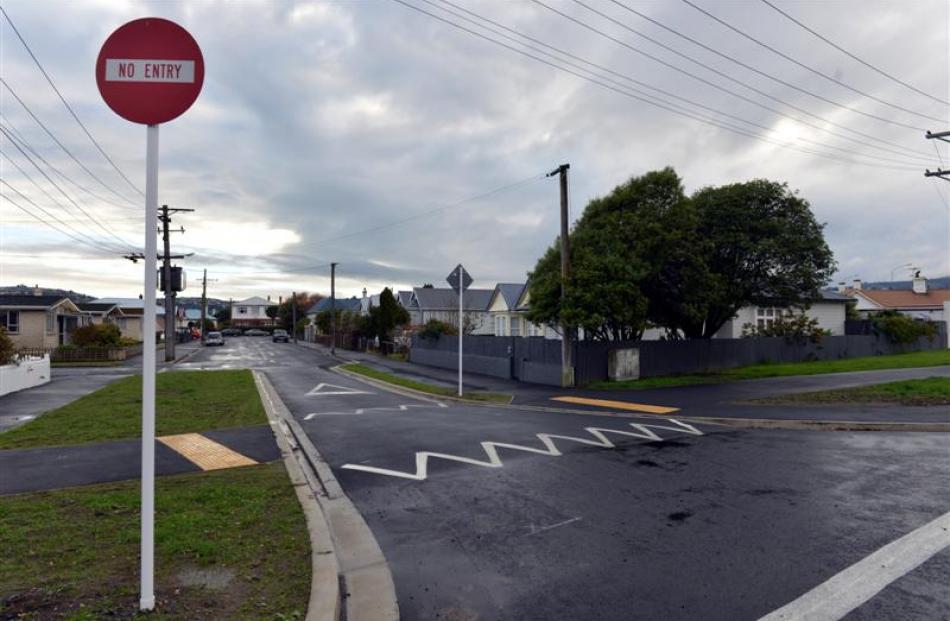 The new cycle lane in Royal Cres crosses Rugby St, a former two-way street that has been turned...