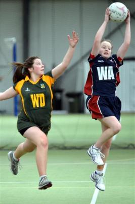 Hayley Jenkinson (left, East Otago)  and Abbey Constable (Kavanagh College) in netball action at...