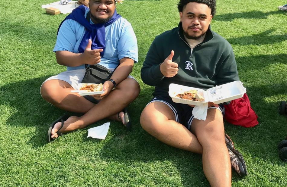 Good mates Itiaki (left) and Faafetai, from Tuvalu and Samoa, enjoy some kai at Moana Nui.