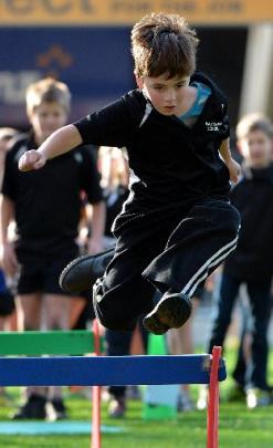 Greg Jones (9), of Waikouaiti School, is focused as he leaps.