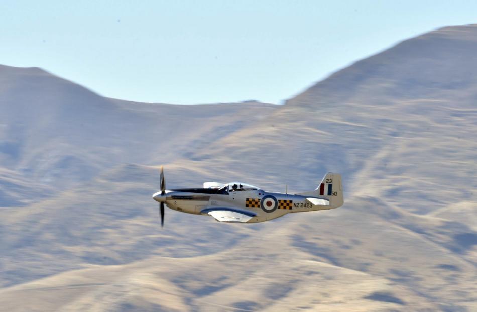 A North American P51 Mustang shot by at speed amid spectacular scenery during a display at the...