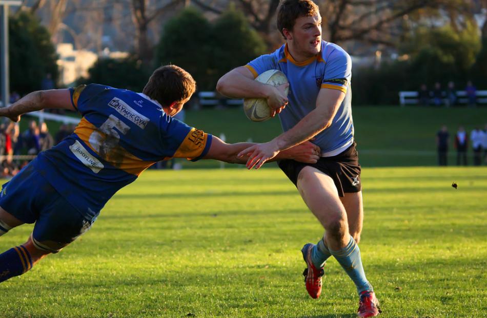 University A hooker and captain Sam Sturgess makes a determined  charge towards the line in the...