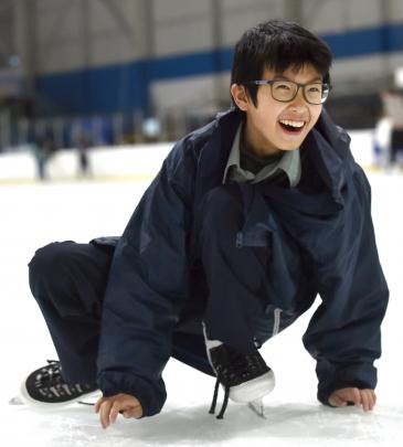 Zev Bai, 14, of China, a year 10 pupil at Bayfield High School, has a laugh as he lowers his...