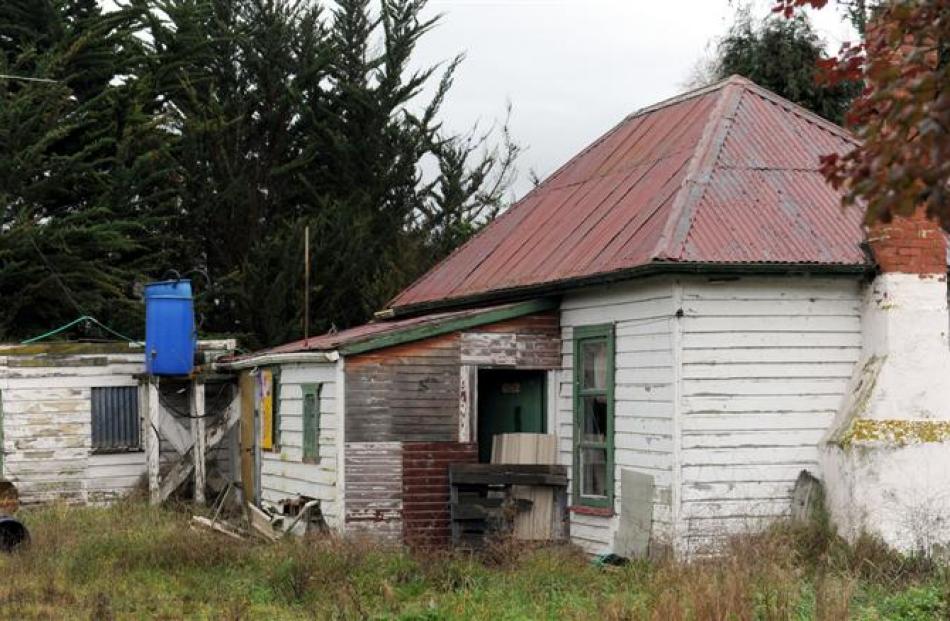 An empty house in Narrowdale Rd, near Otago Corrections Facility, which has had its front door...