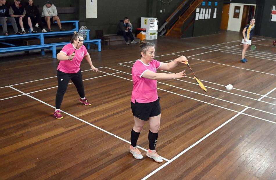 Dunedin badminton identity Andrea Vernall (left) is poised as Anna Ritchie, of Canterbury, serves...