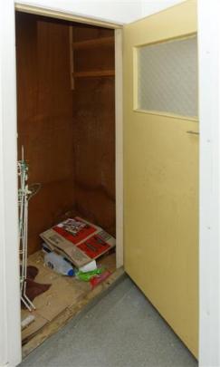 The cupboard in the shearers residence where he hid.