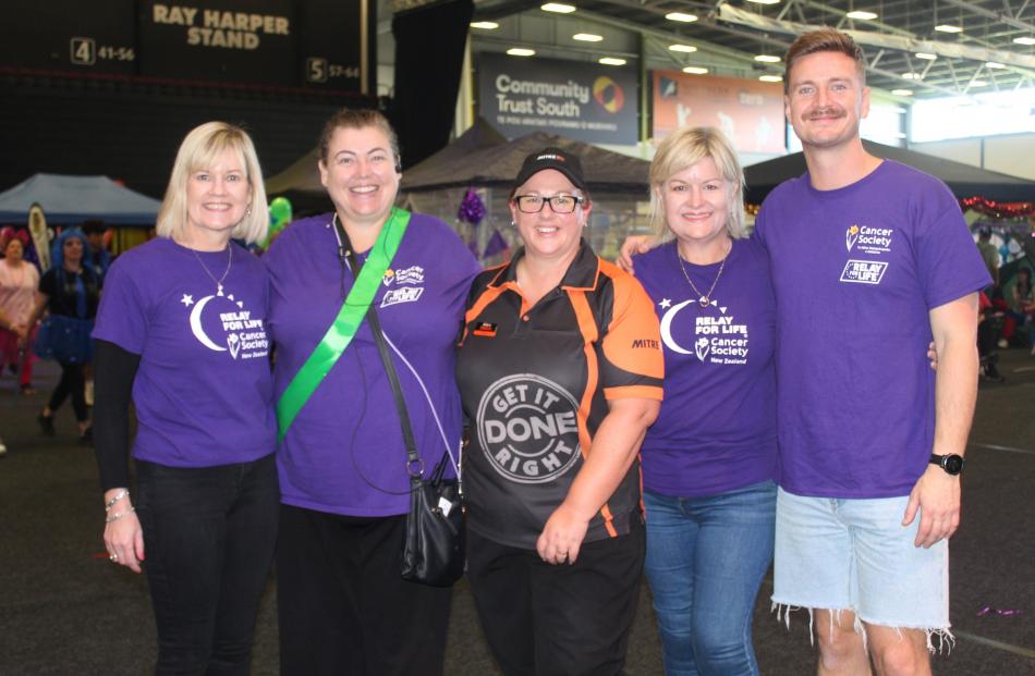 Janet Warhurst and Donna Milne, both of the Cancer Society, Tracy Key, of Mitre 10 Mega, Nicola...