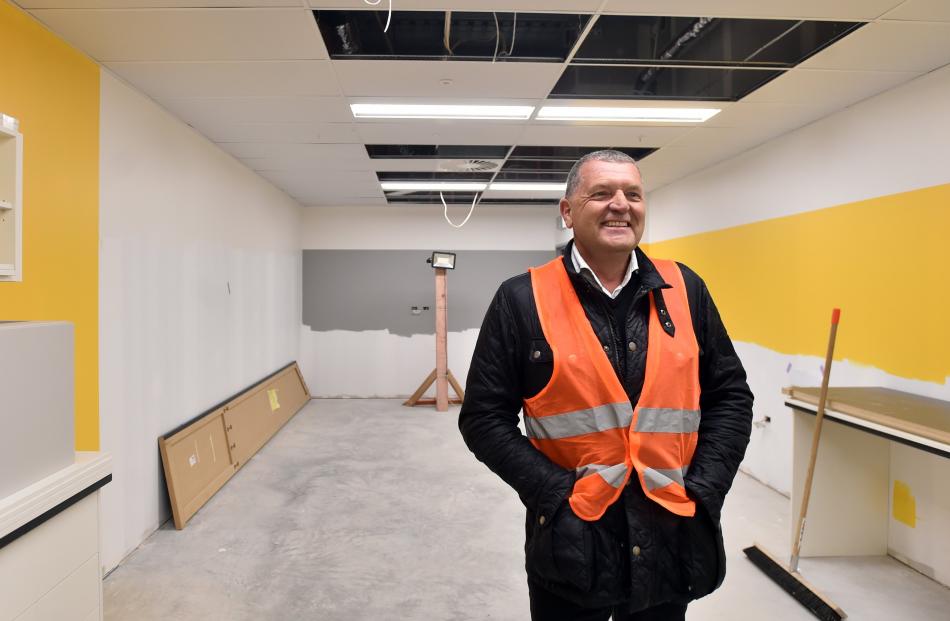 Otago Land Group Ltd director Martin Dippie admires the bright colours of a section of the new...