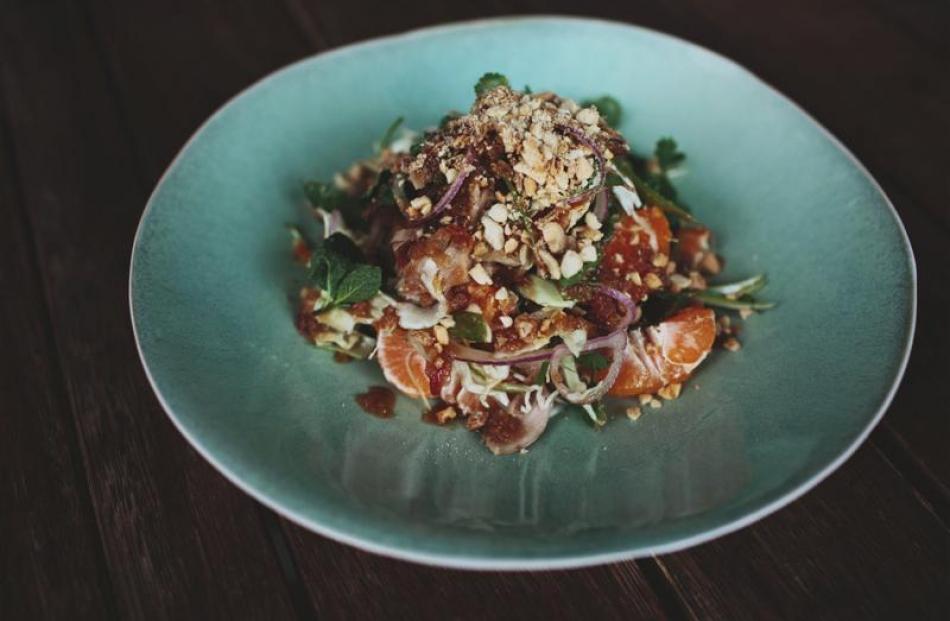 Thai duck salad with roast peanuts, shaved cabbage, tamarind and fresh mandarin.