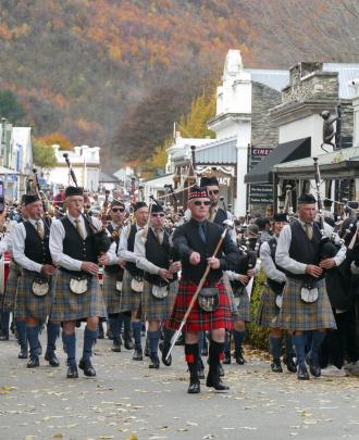 Members of the Southern Lakes Highland Pipe Band perform.