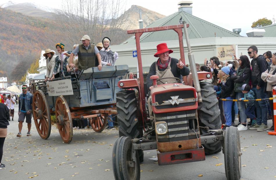 Russell Heckler, of Arrowtown, tows members of the Lakes District Museum including, front, former...