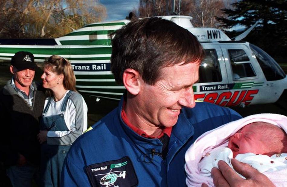 Graeme Gale holds newborn Jade McMillan 15 years ago. Photo supplied.