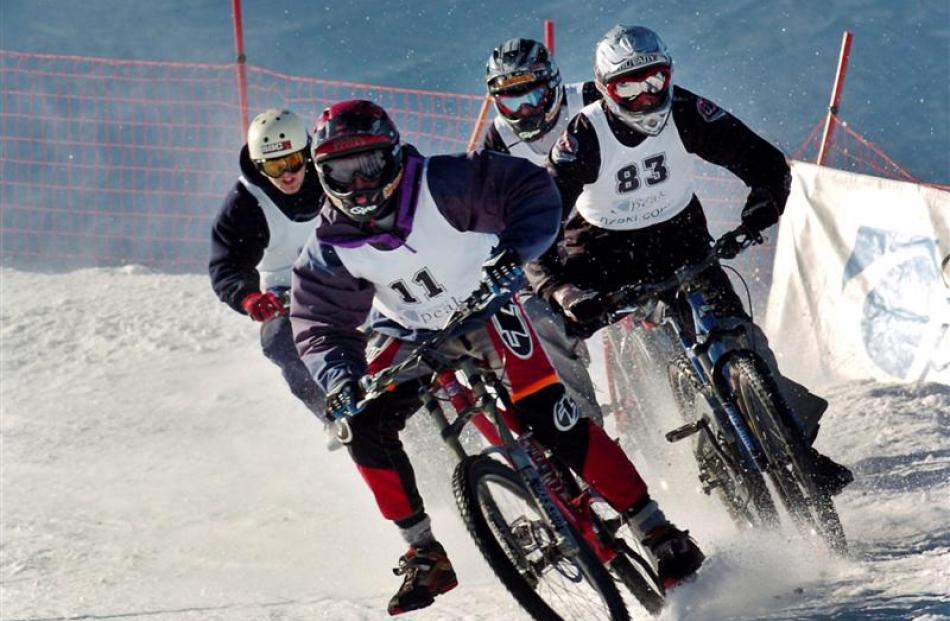 2004: James Dudd of Hamilton leads a heat of the Mountain Bikes on Snow event at Coronet Peak. ...