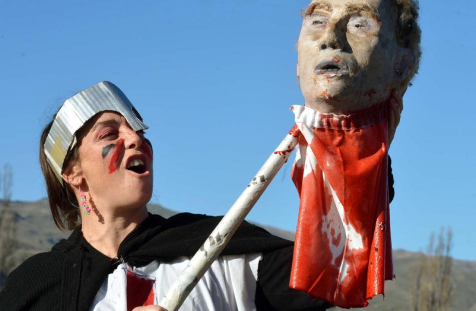 Marissa George, from Waitati, holds the severed head of Henry de Bohun.