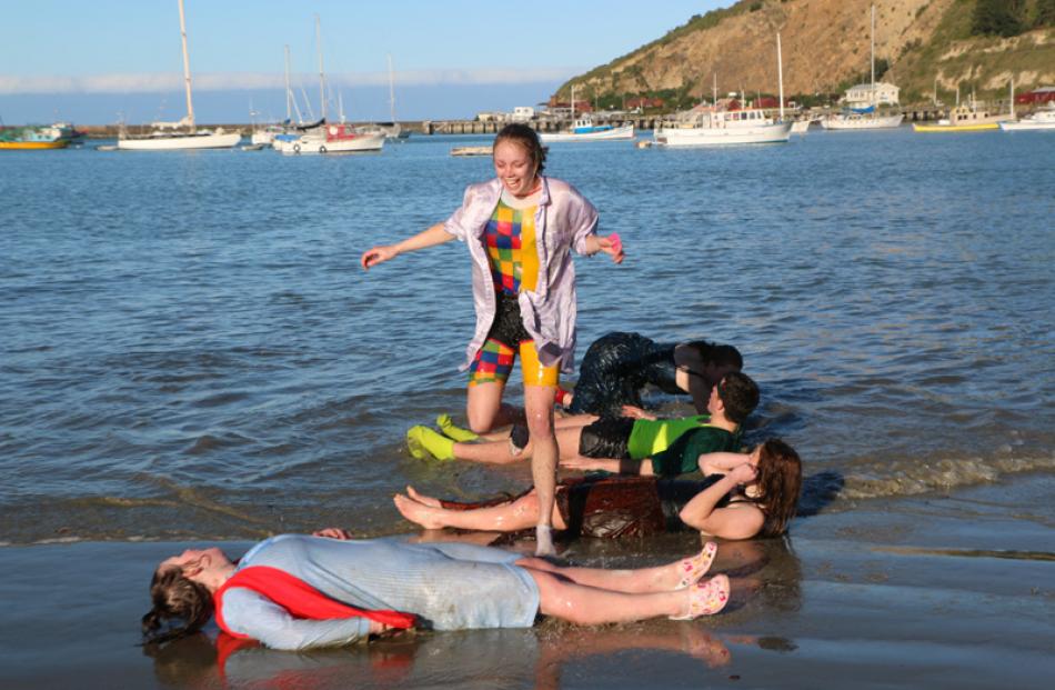 Sydney Telfer, 16, jumps over her Oamaru Rowing Club team members.