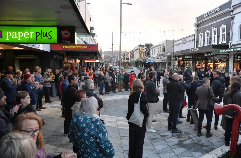 An early morning crowd braves the autumnal chill to celebrate the opening of the new and improved...