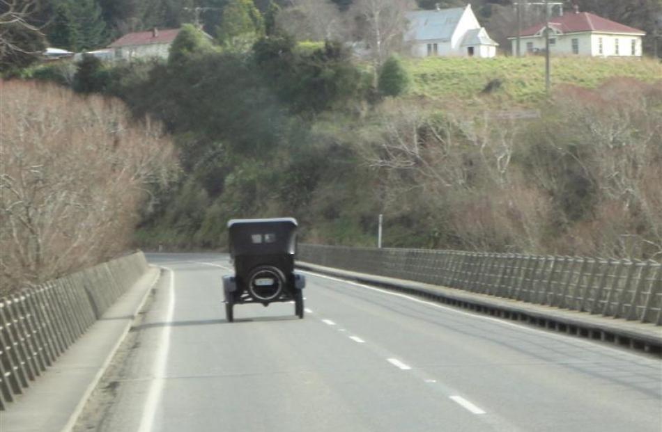 David Roff's 1927 Model T Ford crosses the Taieri River near Outram on Saturday.