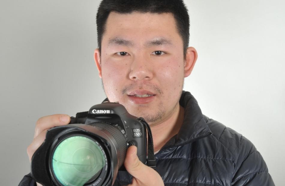 Terence  Huang (25) with the camera that captured the strange objects in the sky on Monday night....